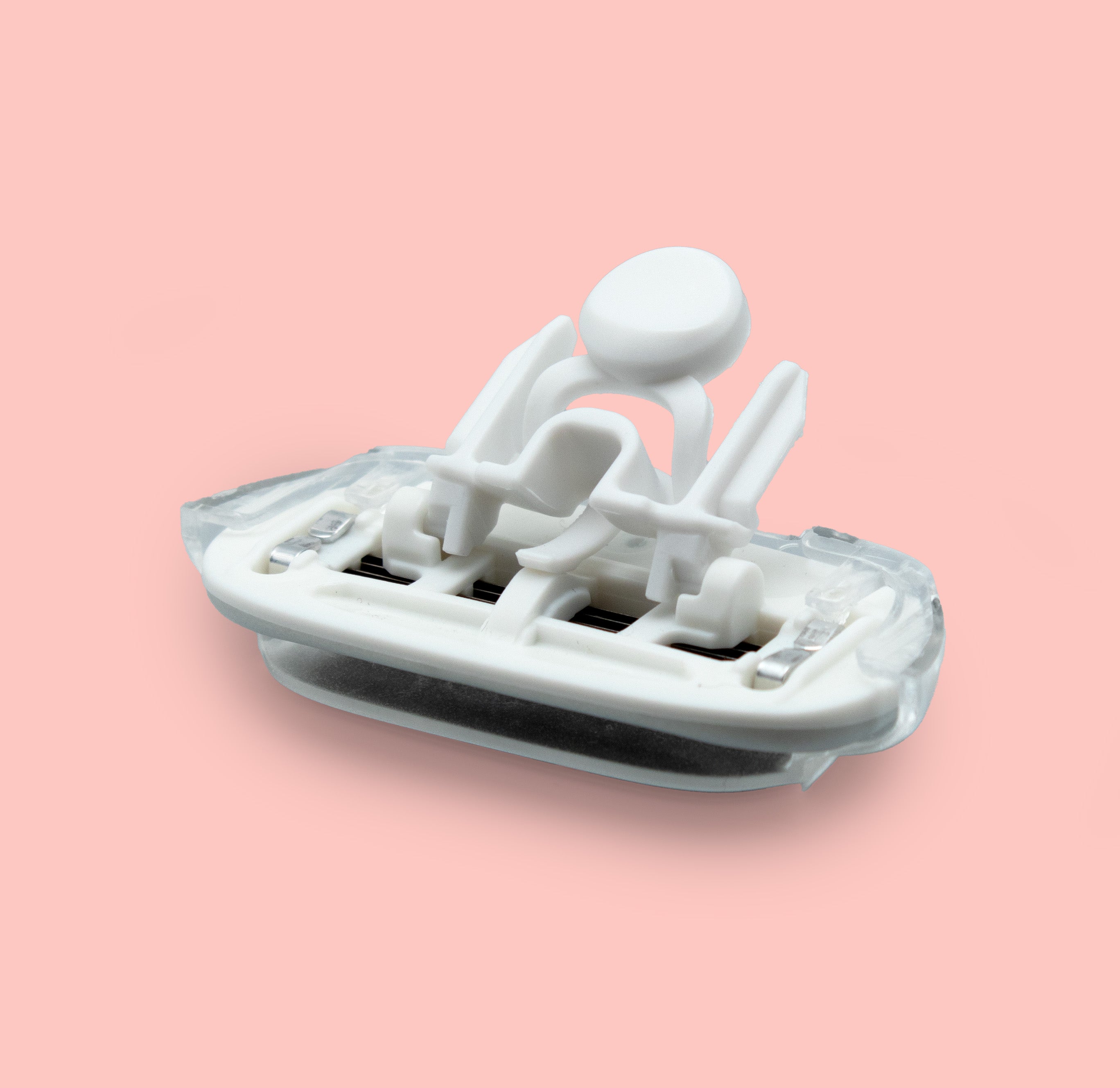 Razor blade cartridge on pink