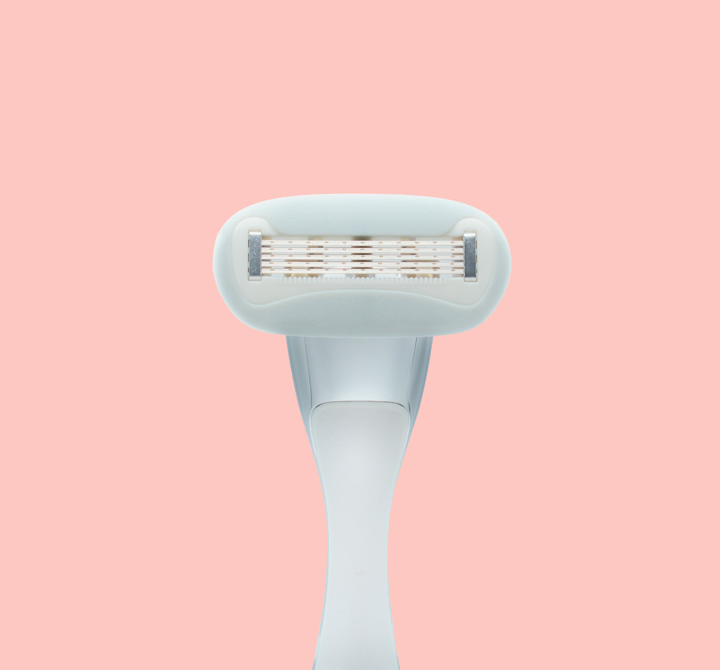 Underside of pink razor on pink