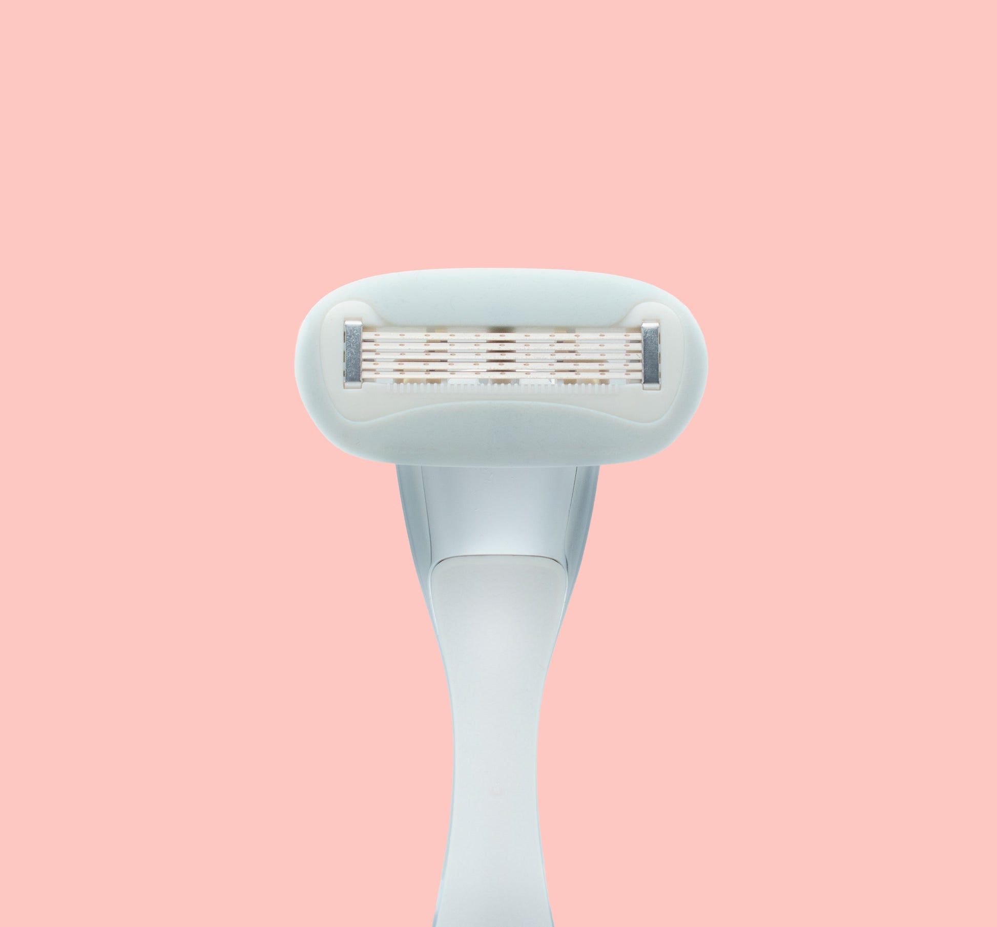 Underside of pink razor on pink
